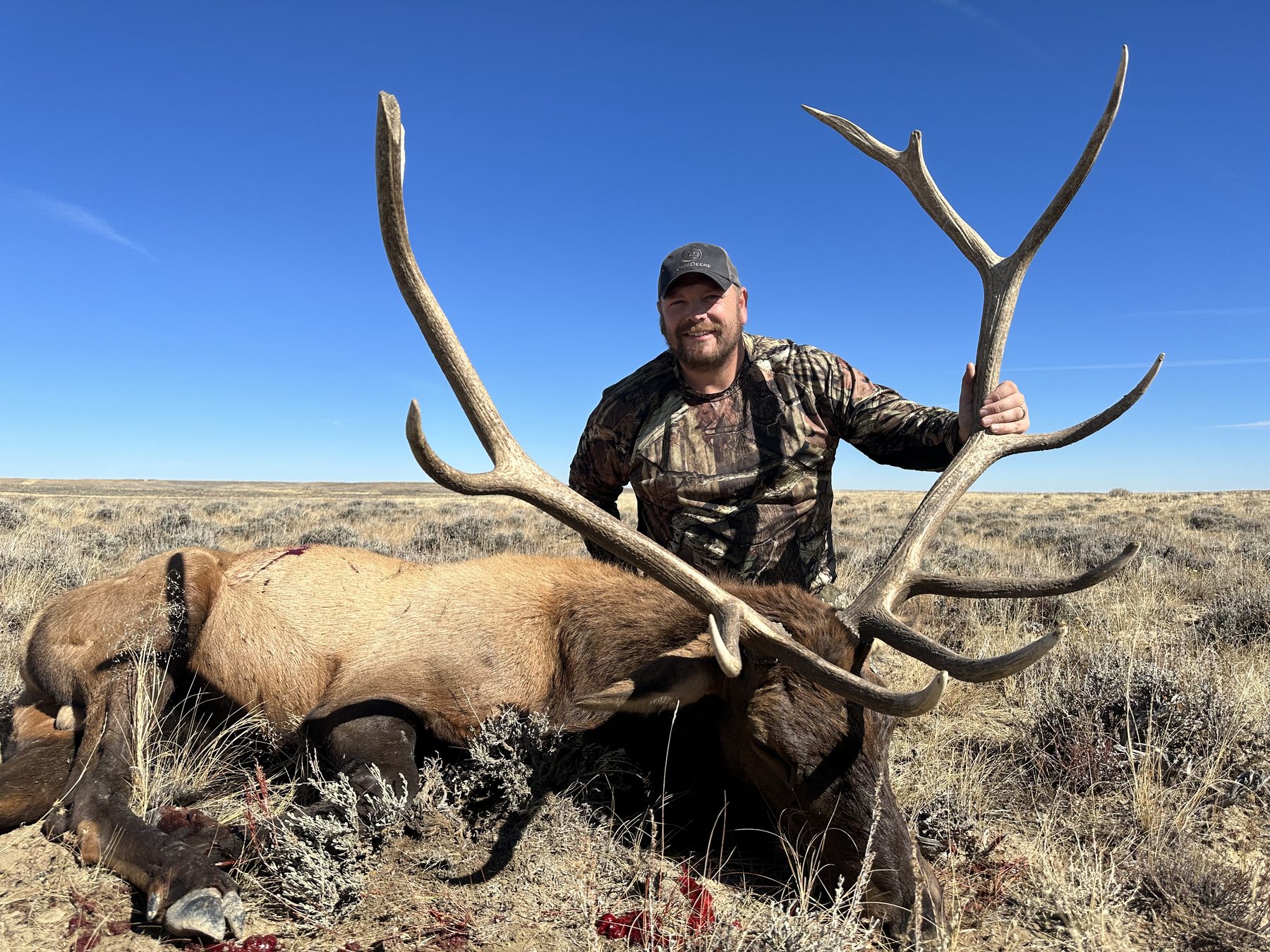 Hunter with trophy bull elk