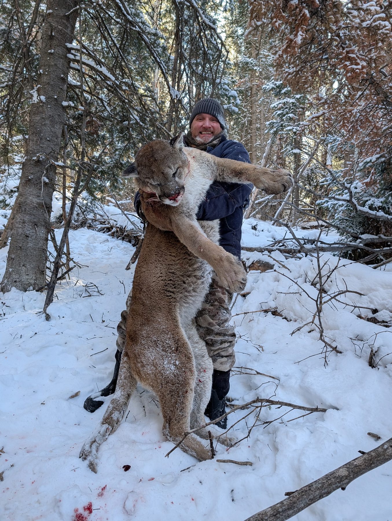 Hunter with mountain lion harvested at Smith Rancho